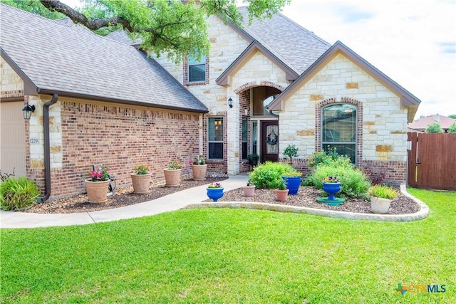 1729 Yturria Dr, Belton, TX 76513 - french country home with stone siding, roof with shingles, and a garage