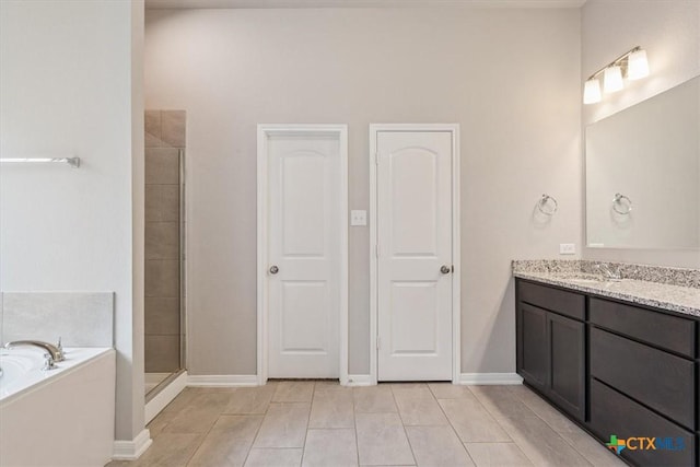 1202 Amber Dawn Dr, Temple, TX 76502 - bathroom with vanity, a garden tub, a stall shower, and tile patterned flooring