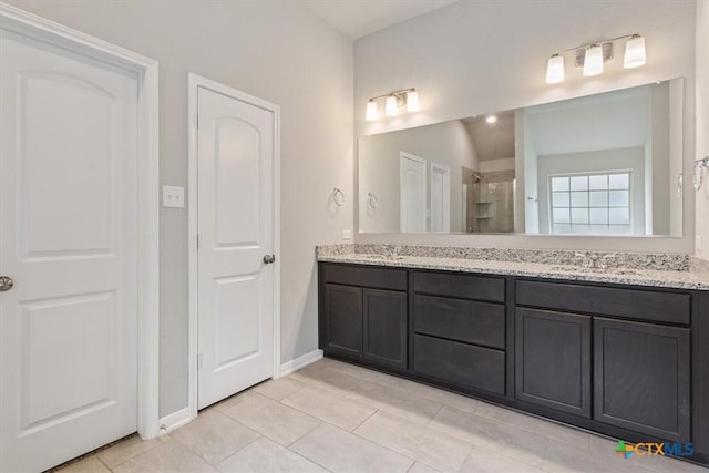 1202 Amber Dawn Dr, Temple, TX 76502 - full bath with a shower stall, double vanity, and tile patterned floors