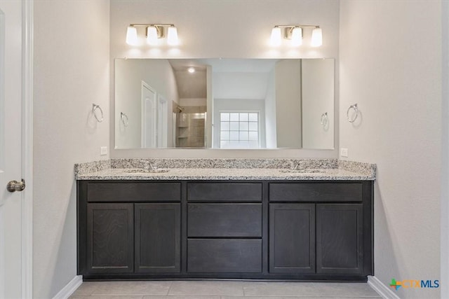 1202 Amber Dawn Dr, Temple, TX 76502 - full bath with double vanity, a tile shower, and tile patterned floors