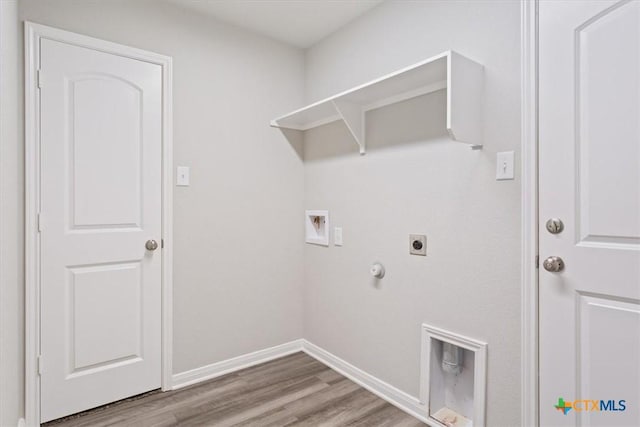 1202 Amber Dawn Dr, Temple, TX 76502 - laundry area with hookup for an electric dryer, hookup for a gas dryer, hookup for a washing machine, and wood finished floors