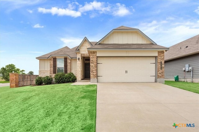 1202 Amber Dawn Dr, Temple, TX 76502 - single story home with board and batten siding, concrete driveway, a garage, and brick siding