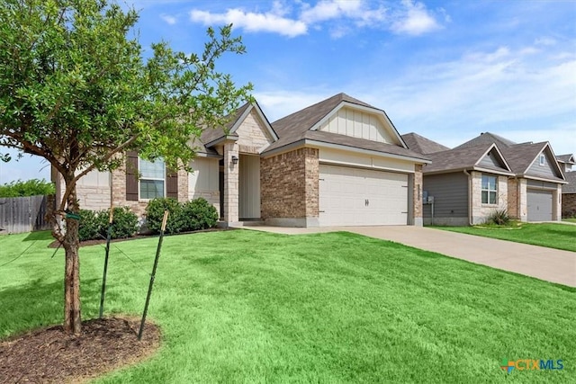 1202 Amber Dawn Dr, Temple, TX 76502 - view of front of house with an attached garage, driveway, and brick siding