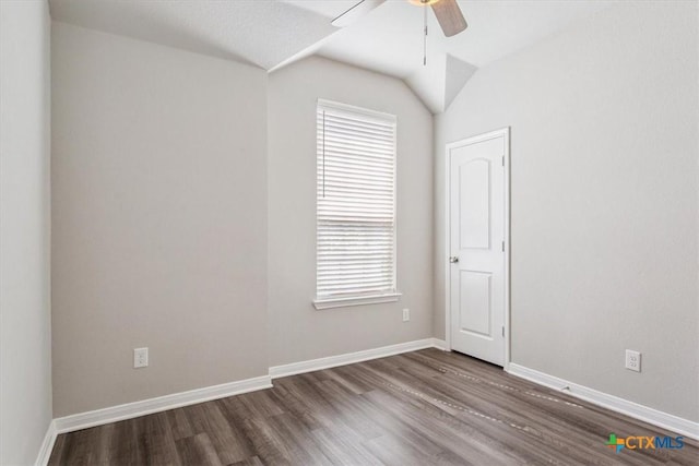 1202 Amber Dawn Dr, Temple, TX 76502 - spare room featuring a ceiling fan, dark wood-type flooring, and lofted ceiling