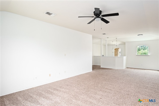 unfurnished living room featuring ceiling fan and carpet floors