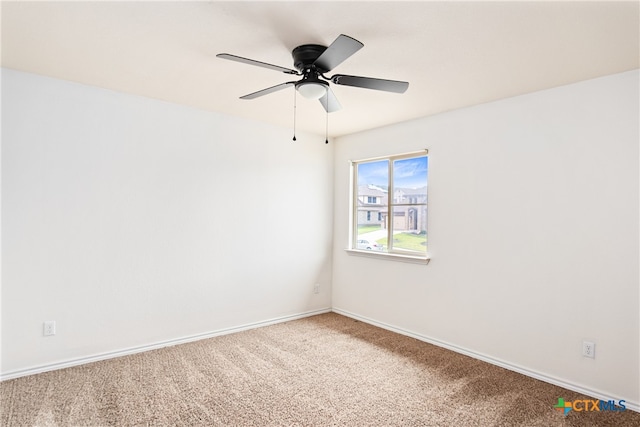 spare room with carpet flooring and ceiling fan