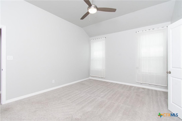 2904 Torino Reale Ave, Temple, TX 76502 - carpeted spare room with vaulted ceiling, a ceiling fan, and baseboards