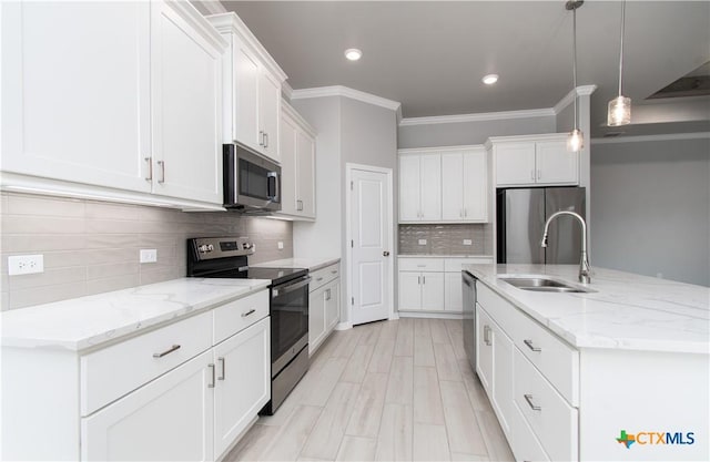 2904 Torino Reale Ave, Temple, TX 76502 - kitchen with appliances with stainless steel finishes, a sink, white cabinets, decorative backsplash, and ornamental molding