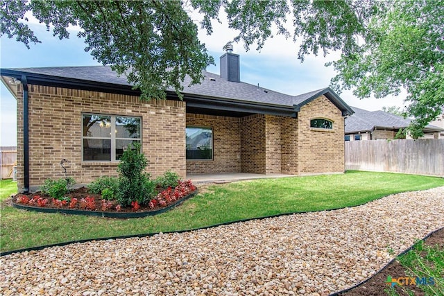 2904 Torino Reale Ave, Temple, TX 76502 - back of property featuring a patio area, brick siding, a chimney, and a shingled roof