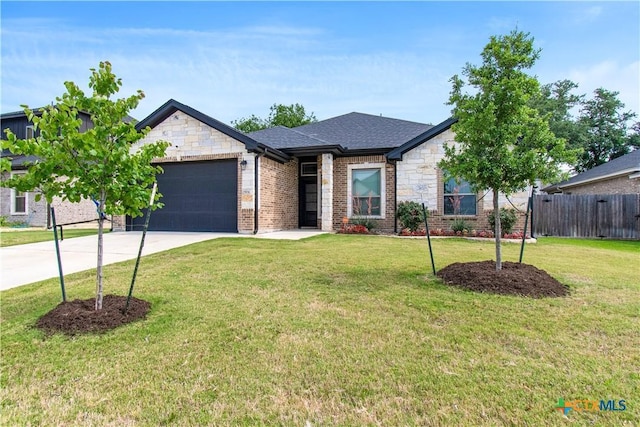 2904 Torino Reale Ave, Temple, TX 76502 - view of front of property with an attached garage, concrete driveway, stone siding, roof with shingles, and brick siding