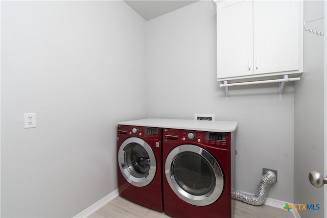 2904 Torino Reale Ave, Temple, TX 76502 - laundry area featuring cabinet space, baseboards, and washer and dryer