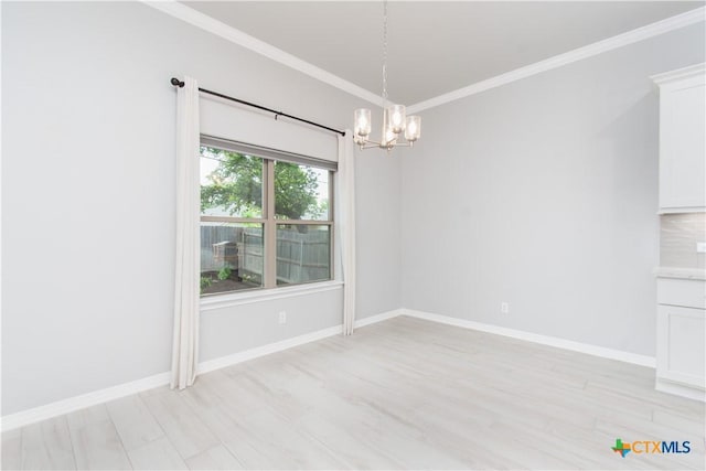 2904 Torino Reale Ave, Temple, TX 76502 - unfurnished dining area with a chandelier, ornamental molding, baseboards, and light wood-style flooring