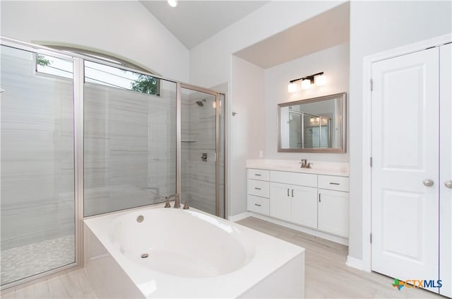 2904 Torino Reale Ave, Temple, TX 76502 - full bathroom featuring a garden tub, a shower stall, vanity, and vaulted ceiling
