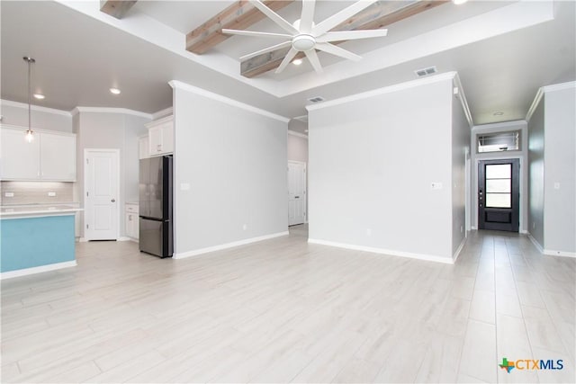 2904 Torino Reale Ave, Temple, TX 76502 - unfurnished living room with beamed ceiling, a ceiling fan, recessed lighting, ornamental molding, and light wood-type flooring