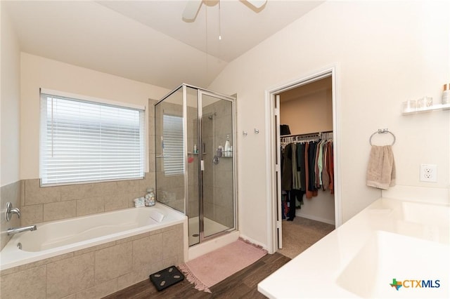 bathroom featuring independent shower and bath, lofted ceiling, and ceiling fan