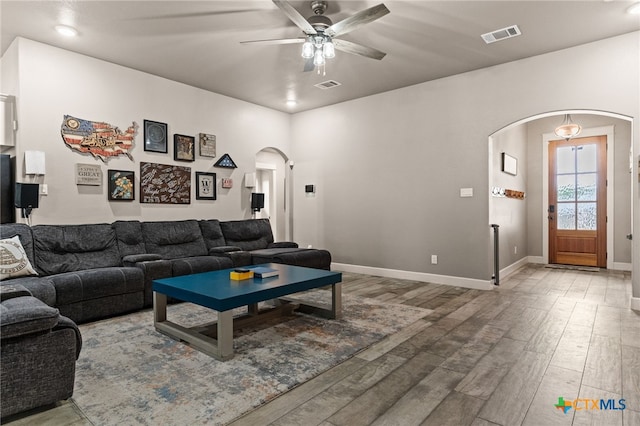 125 Savage Cir, Copperas Cove, TX 76522 - living room with arched walkways, ceiling fan, wood finished floors, baseboards, and recessed lighting
