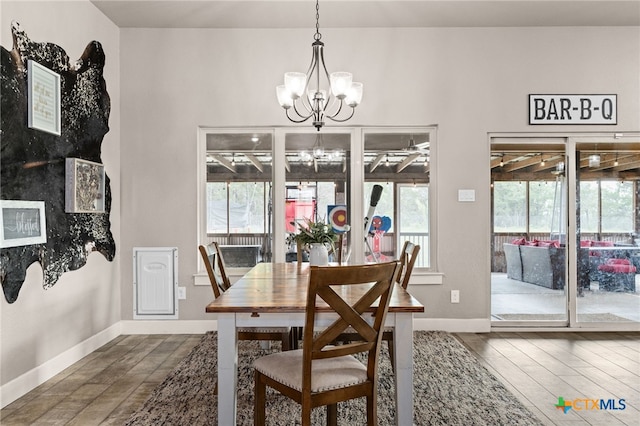 125 Savage Cir, Copperas Cove, TX 76522 - dining space with a chandelier, wood finished floors, and baseboards