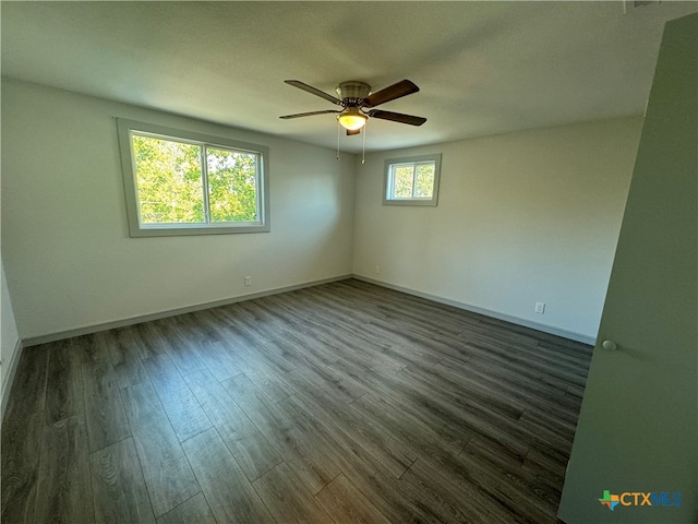 empty room with hardwood / wood-style floors and ceiling fan