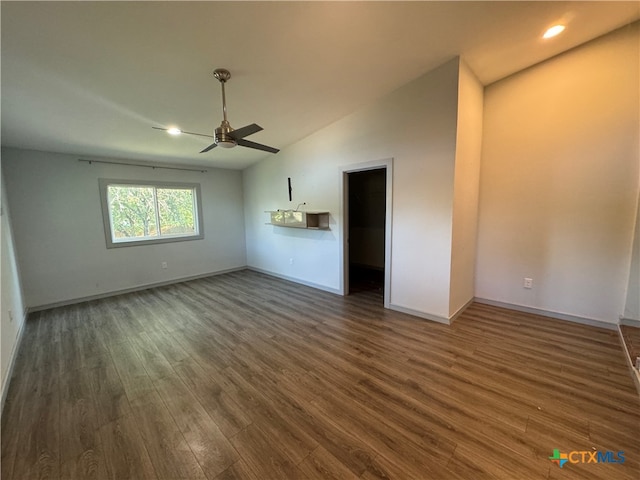 interior space with vaulted ceiling, ceiling fan, and dark hardwood / wood-style flooring