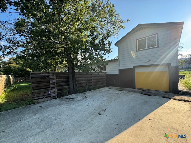 view of side of home with a garage