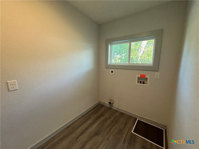 laundry room featuring dark hardwood / wood-style floors, hookup for a washing machine, and hookup for an electric dryer