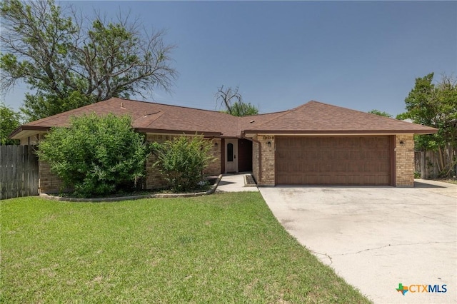 1008 Woodshadows Dr, Harker Heights, TX 76548 - single story home with an attached garage, brick siding, and driveway