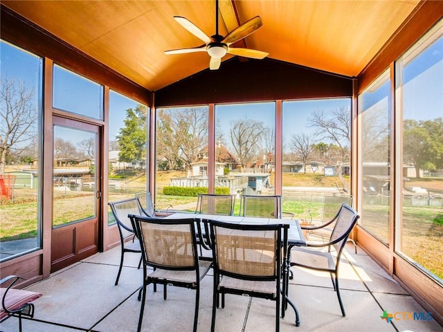 106 Flamingo Cir, Marble Falls, TX 78654 - sunroom / solarium featuring a ceiling fan, vaulted ceiling, outdoor dining area, and a residential view