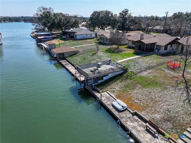 106 Flamingo Cir, Marble Falls, TX 78654 - dock with a water view, a residential view, and fence