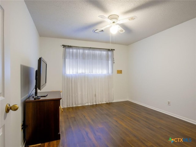 106 Flamingo Cir, Marble Falls, TX 78654 - unfurnished living room with ceiling fan, wood finished floors, a textured ceiling, and baseboards
