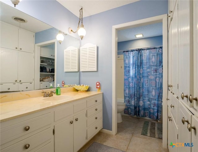 106 Flamingo Cir, Marble Falls, TX 78654 - full bathroom with toilet, tile patterned flooring, vanity, curtained shower, and baseboards