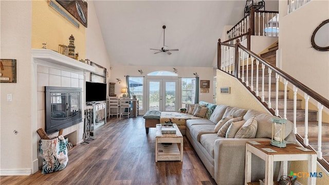 living room featuring dark wood-type flooring, high vaulted ceiling, french doors, and ceiling fan