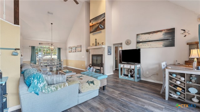 living room featuring hardwood / wood-style flooring and high vaulted ceiling