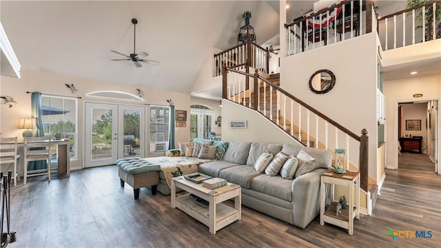 living room featuring ceiling fan, dark hardwood / wood-style floors, high vaulted ceiling, and french doors