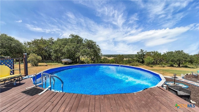 view of pool featuring a deck