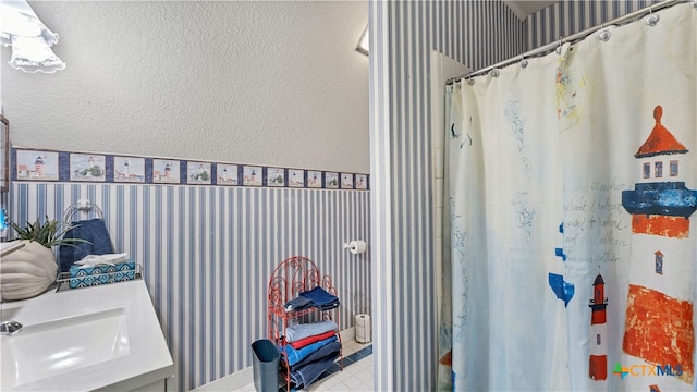 bathroom with a shower with curtain and vanity