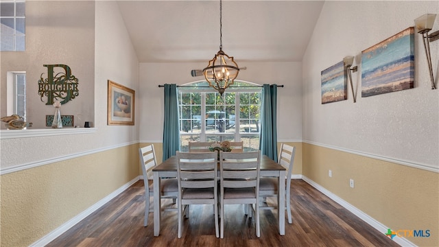 dining area with vaulted ceiling, dark wood-type flooring, and a chandelier