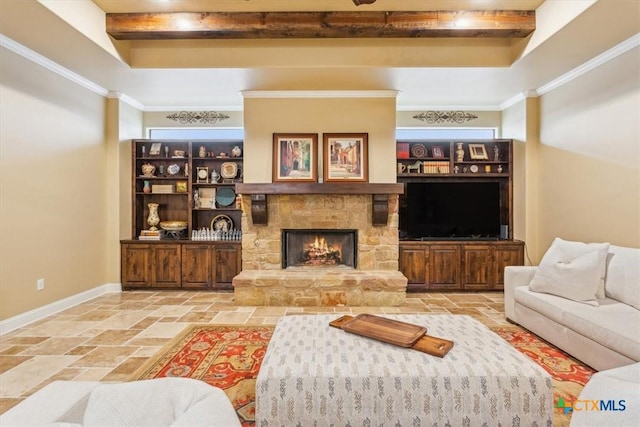 living room featuring stone tile floors, baseboards, beamed ceiling, crown molding, and a fireplace