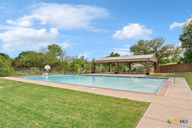 view of swimming pool with a lawn, a gazebo, fence, and a fenced in pool