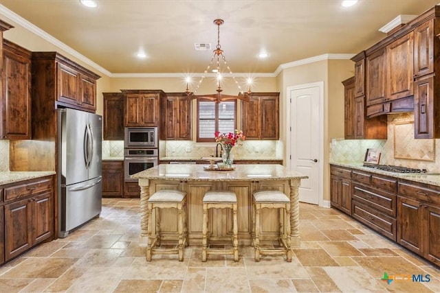 kitchen with a breakfast bar, stone tile flooring, a center island, decorative backsplash, and appliances with stainless steel finishes