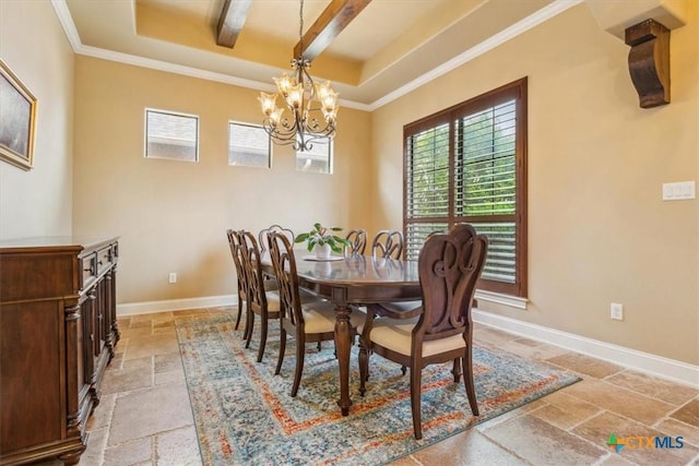 dining space with a raised ceiling, ornamental molding, stone tile flooring, baseboards, and a notable chandelier