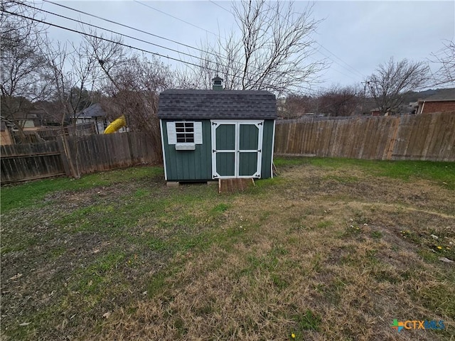 view of outdoor structure featuring a lawn