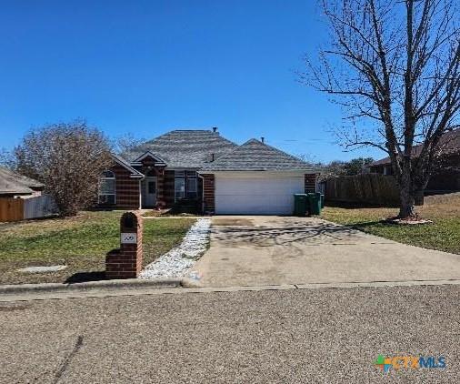 single story home featuring a garage