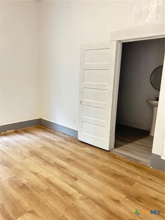 1108 S 47th St, Temple, TX 76504 - spare room with light wood finished floors and baseboards