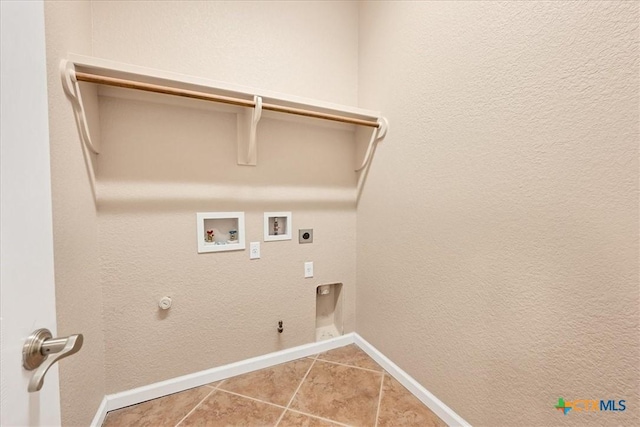 laundry area featuring gas dryer hookup, hookup for a washing machine, tile patterned flooring, and electric dryer hookup