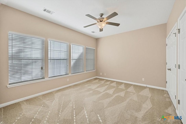 unfurnished bedroom featuring ceiling fan and light colored carpet