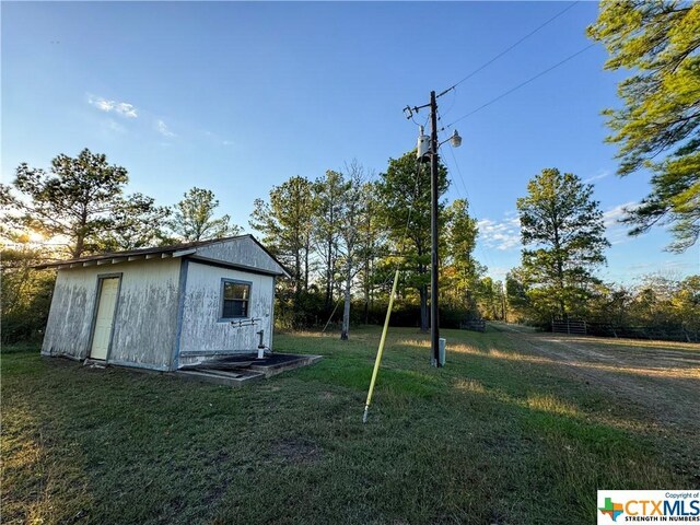 21 Anderson Ln, Coldspring, TX 77331 - view of grassy yard featuring an outdoor structure