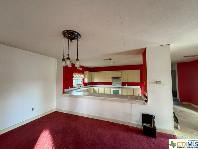 21 Anderson Ln, Coldspring, TX 77331 - kitchen featuring white electric stove, under cabinet range hood, a textured ceiling, baseboards, and a sink