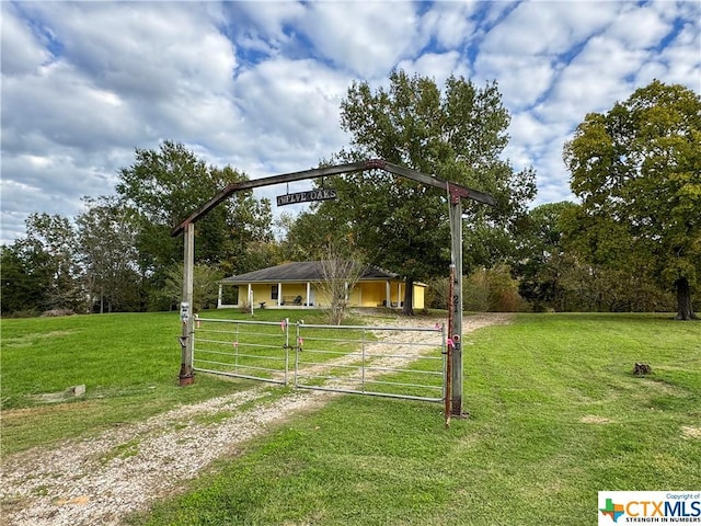 21 Anderson Ln, Coldspring, TX 77331 - view of front of property with a gate, a front yard, and driveway
