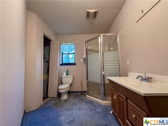 bathroom with a shower with door, vanity, a textured ceiling, water heater, and toilet