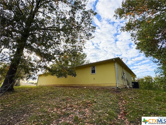 view of home's exterior with central air condition unit